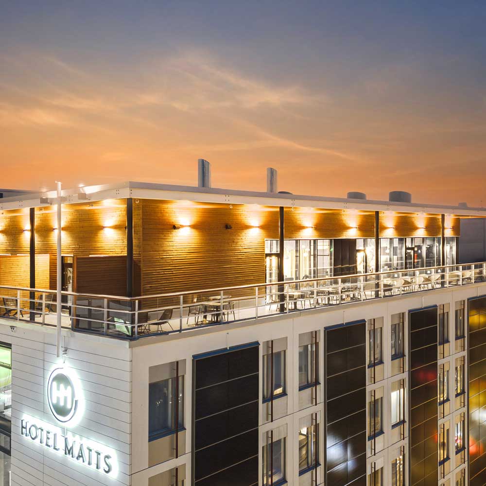 Exterior view of Freja Rooftop in the evening.