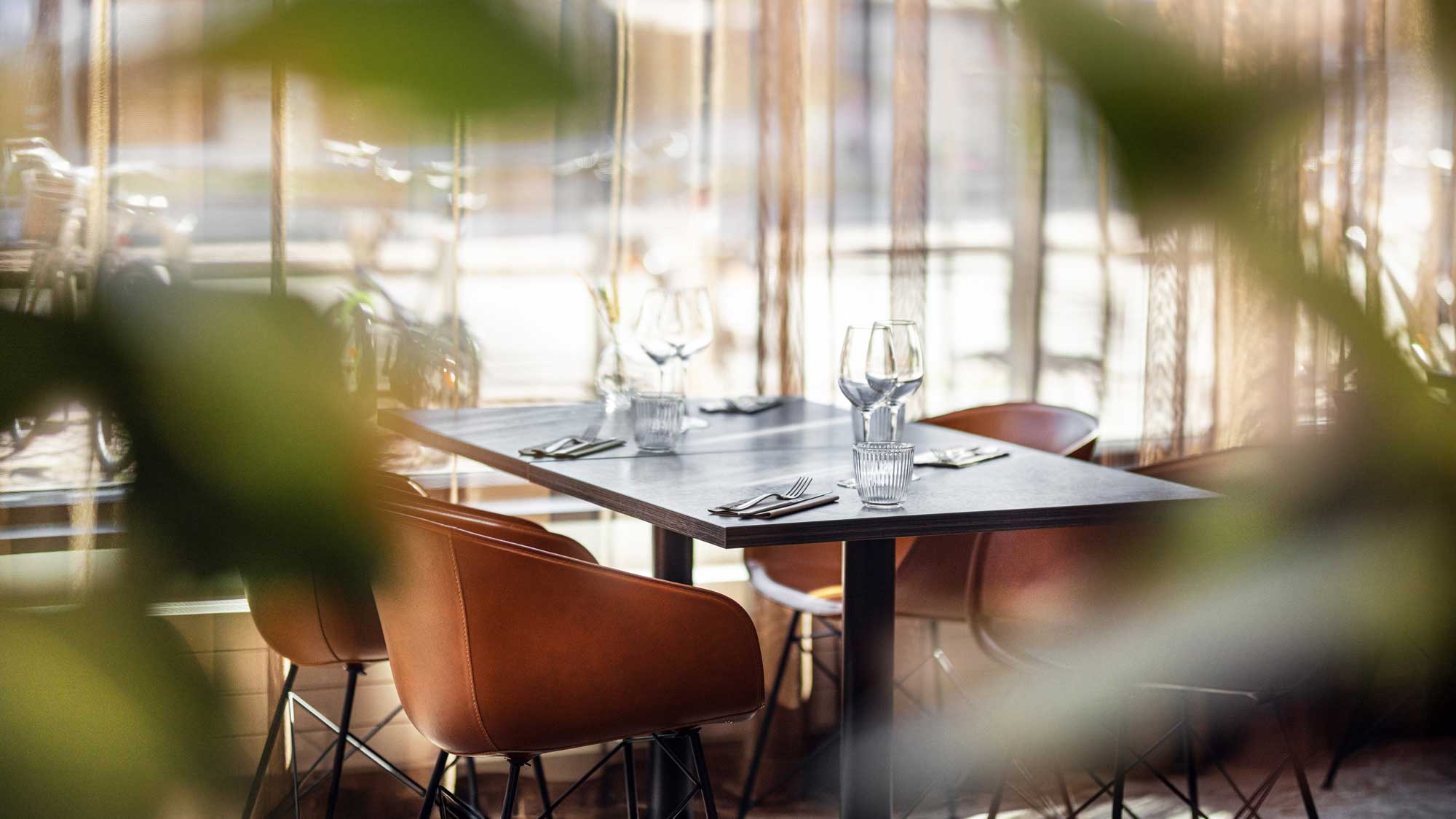 Set dinner table in the dining hall at Restaurant Freja.